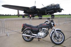 Two historic machines - The Lancaster "Just Jane" and Honda's Superdream pictured at East Kirkby airfield during a Lincolnshire Bike Night meeting.